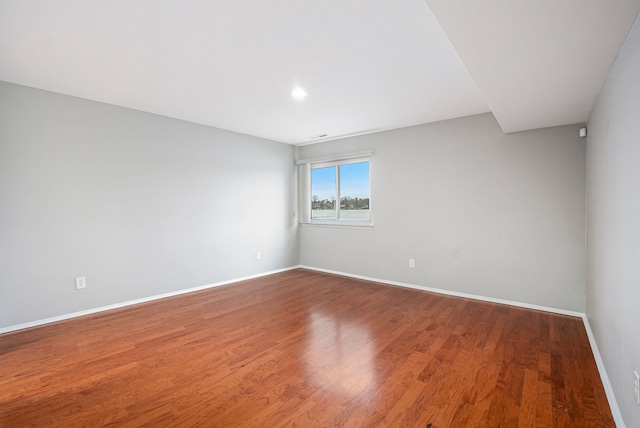 spare room featuring hardwood / wood-style floors