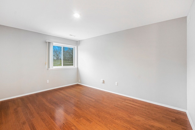 empty room featuring hardwood / wood-style flooring