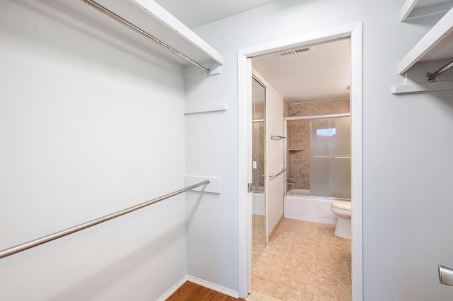 walk in closet featuring light tile patterned floors