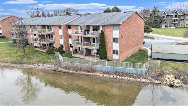 view of property with a water view