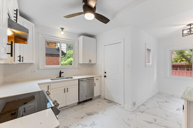 kitchen featuring decorative backsplash, dishwasher, white cabinets, and a healthy amount of sunlight