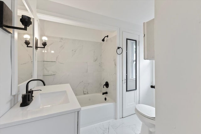 full bathroom featuring vanity, tiled shower / bath combo, and toilet