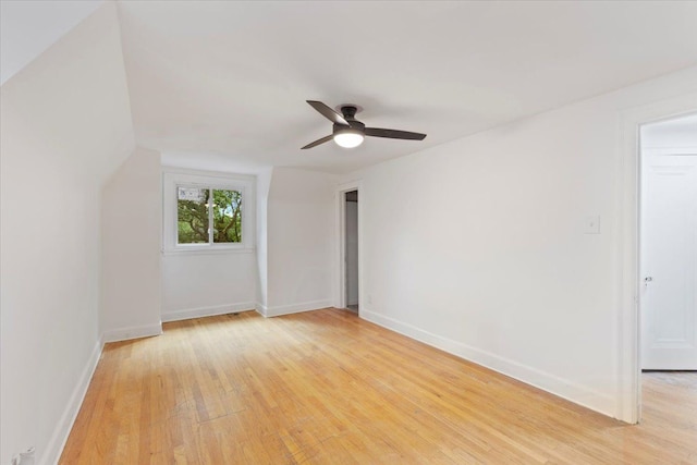 spare room with light wood-type flooring and ceiling fan