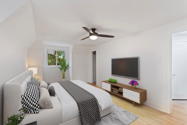 bedroom with ceiling fan and light wood-type flooring