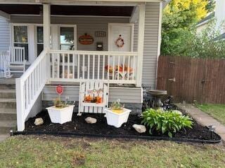 property entrance with covered porch