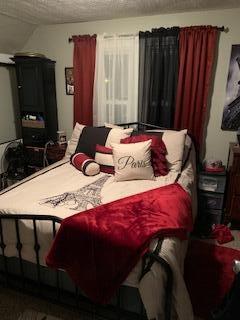 bedroom featuring a textured ceiling