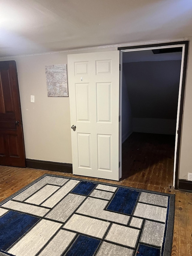 interior space with a closet and dark hardwood / wood-style floors