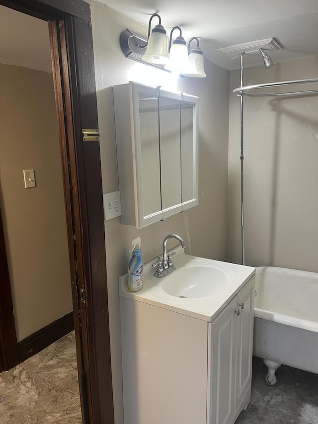 bathroom with a bathtub and vanity