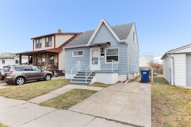 view of front of home featuring covered porch and a front lawn