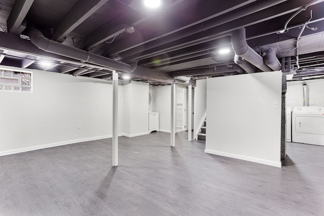 basement with washer / dryer and hardwood / wood-style floors