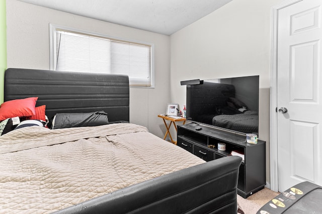 carpeted bedroom featuring vaulted ceiling