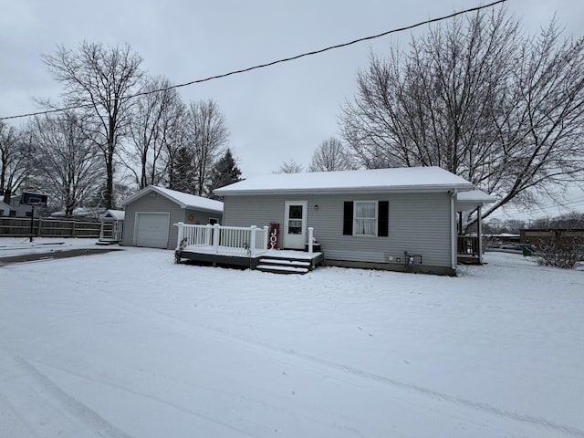 view of front of property featuring a garage and an outbuilding