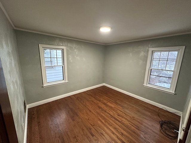 unfurnished room featuring crown molding and dark hardwood / wood-style flooring