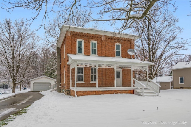 view of front of property with a porch, an outdoor structure, and a garage