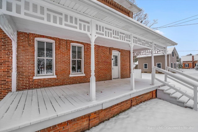 view of snow covered deck