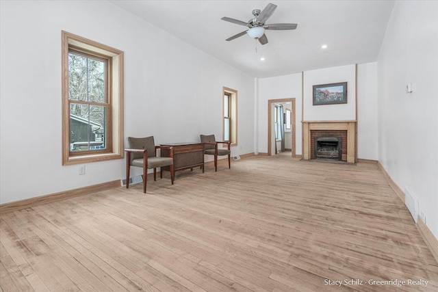 sitting room featuring ceiling fan and light hardwood / wood-style flooring