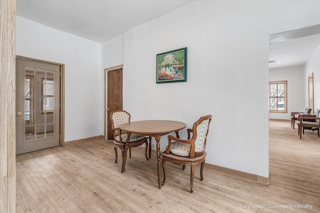 dining area featuring light wood-type flooring