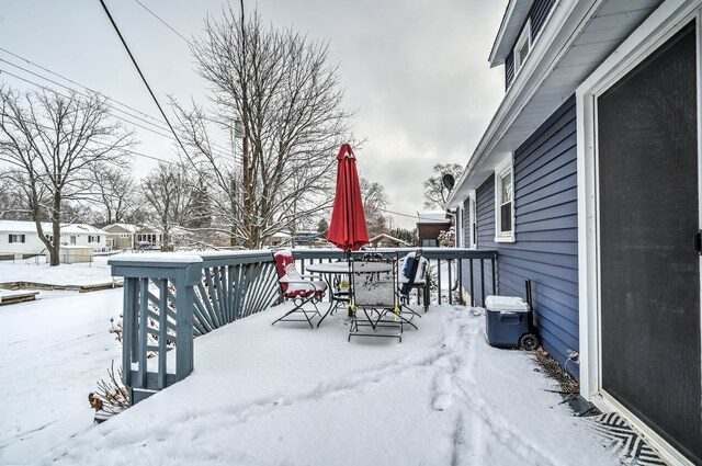 view of snow covered deck