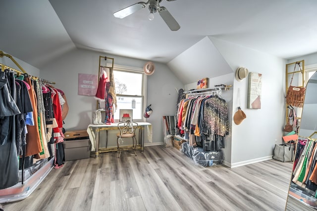 spacious closet featuring light wood-type flooring, ceiling fan, and lofted ceiling