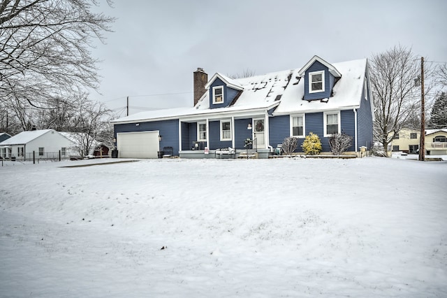 cape cod house with a garage