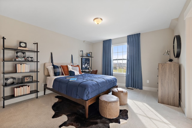 bedroom with light carpet