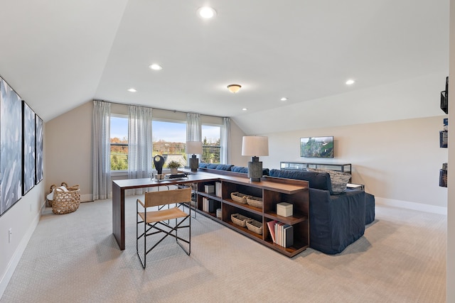 carpeted office space featuring lofted ceiling