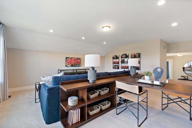 office with light colored carpet and lofted ceiling