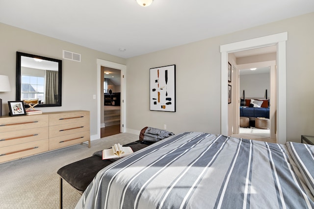 bedroom featuring light carpet