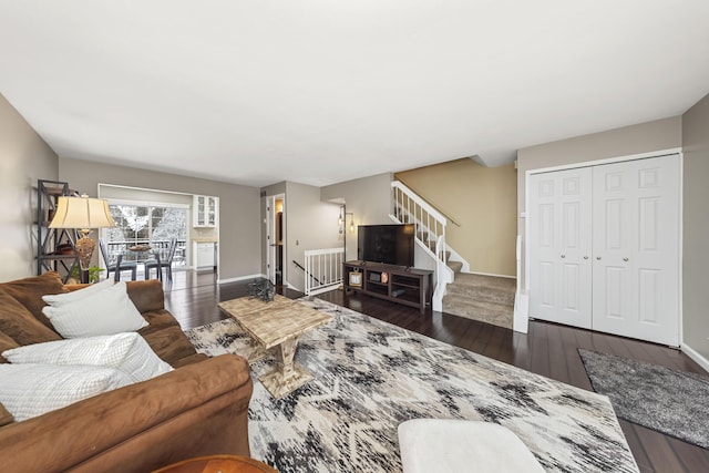 living room with dark hardwood / wood-style floors