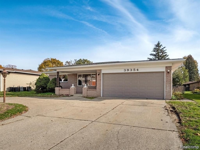 single story home with a porch and a garage