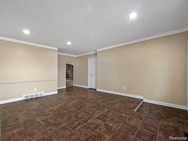 spare room featuring ornamental molding