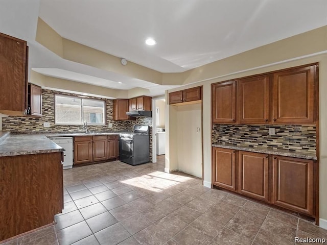 kitchen featuring stove, white dishwasher, sink, decorative backsplash, and light tile patterned floors