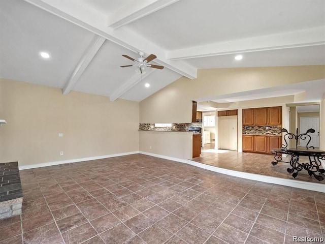 unfurnished living room with vaulted ceiling with beams and ceiling fan