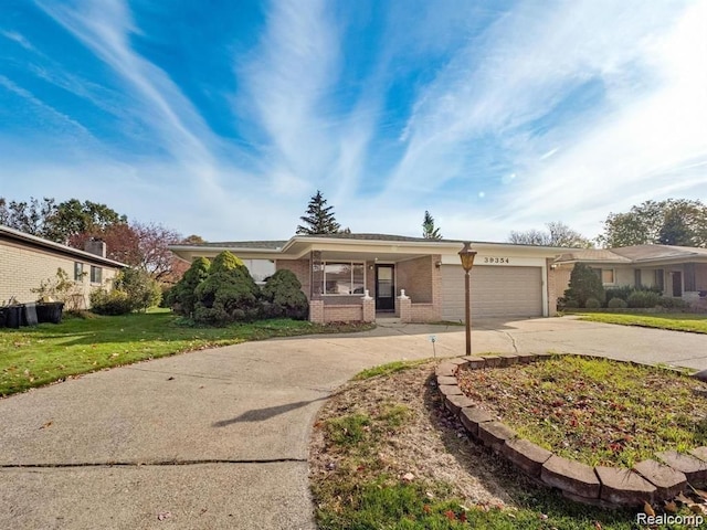 single story home with a front lawn and a garage