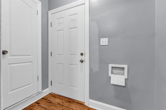 doorway to outside with wood-type flooring