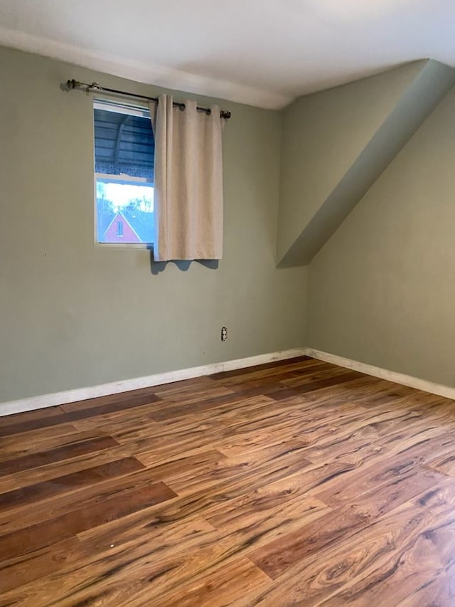 empty room with hardwood / wood-style floors