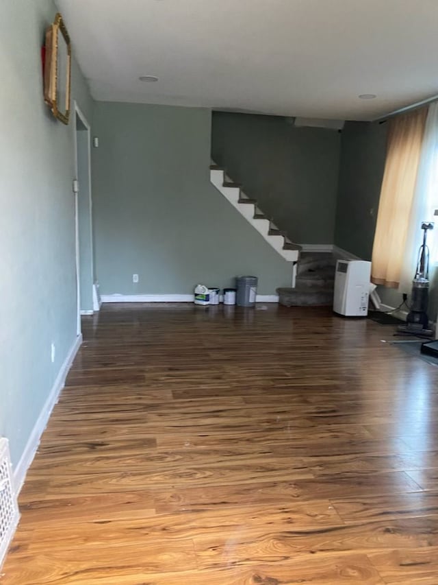 unfurnished room featuring hardwood / wood-style flooring