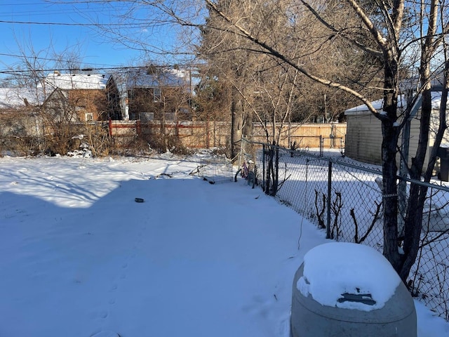 view of yard layered in snow