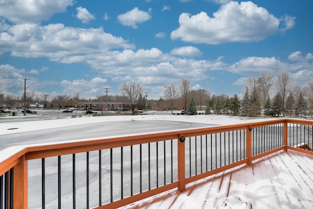 view of snow covered deck