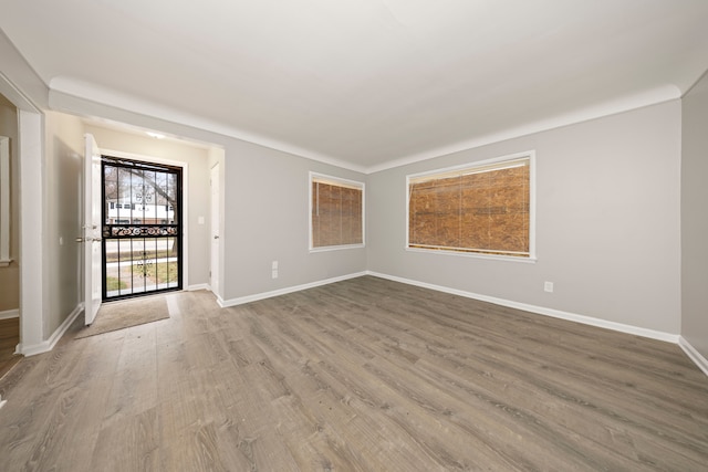 spare room with light hardwood / wood-style floors