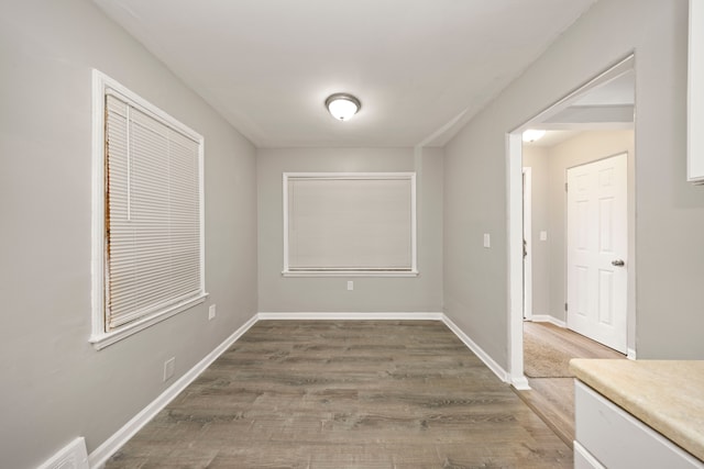 interior space with dark hardwood / wood-style flooring