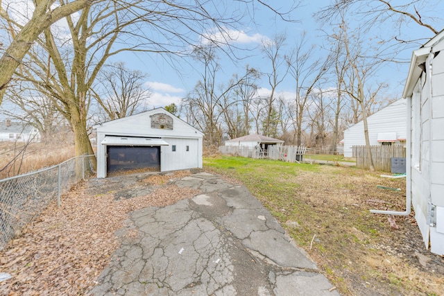 view of yard with a garage and an outdoor structure