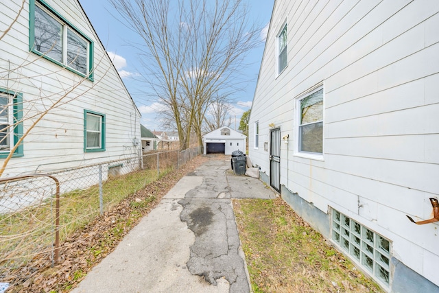 view of side of property featuring an outbuilding and a garage