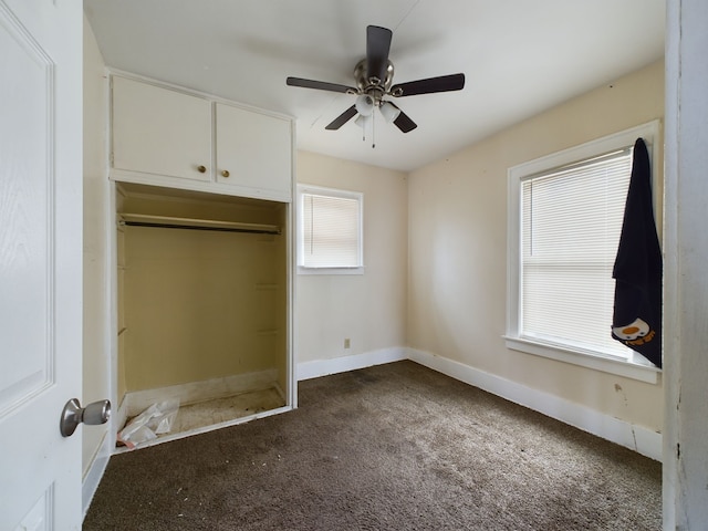 unfurnished bedroom featuring carpet flooring, ceiling fan, and a closet