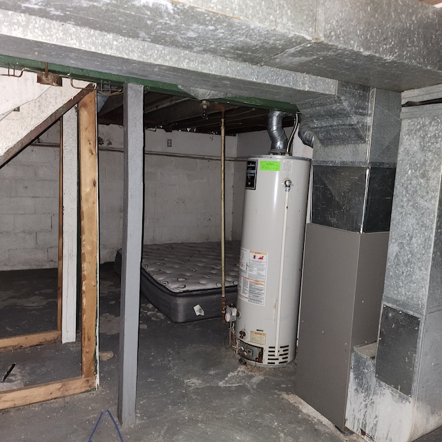 interior space featuring gas water heater and heating unit