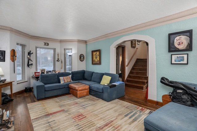 living room featuring hardwood / wood-style floors and crown molding