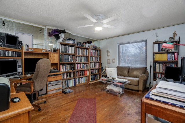 office area with ceiling fan, dark hardwood / wood-style flooring, and a textured ceiling