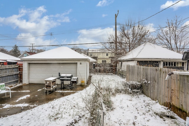 view of snow covered garage