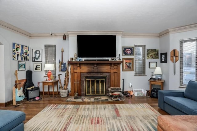 living room with hardwood / wood-style floors and crown molding