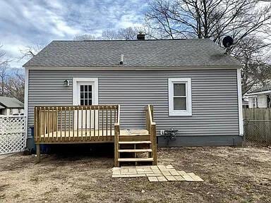 rear view of house with a deck